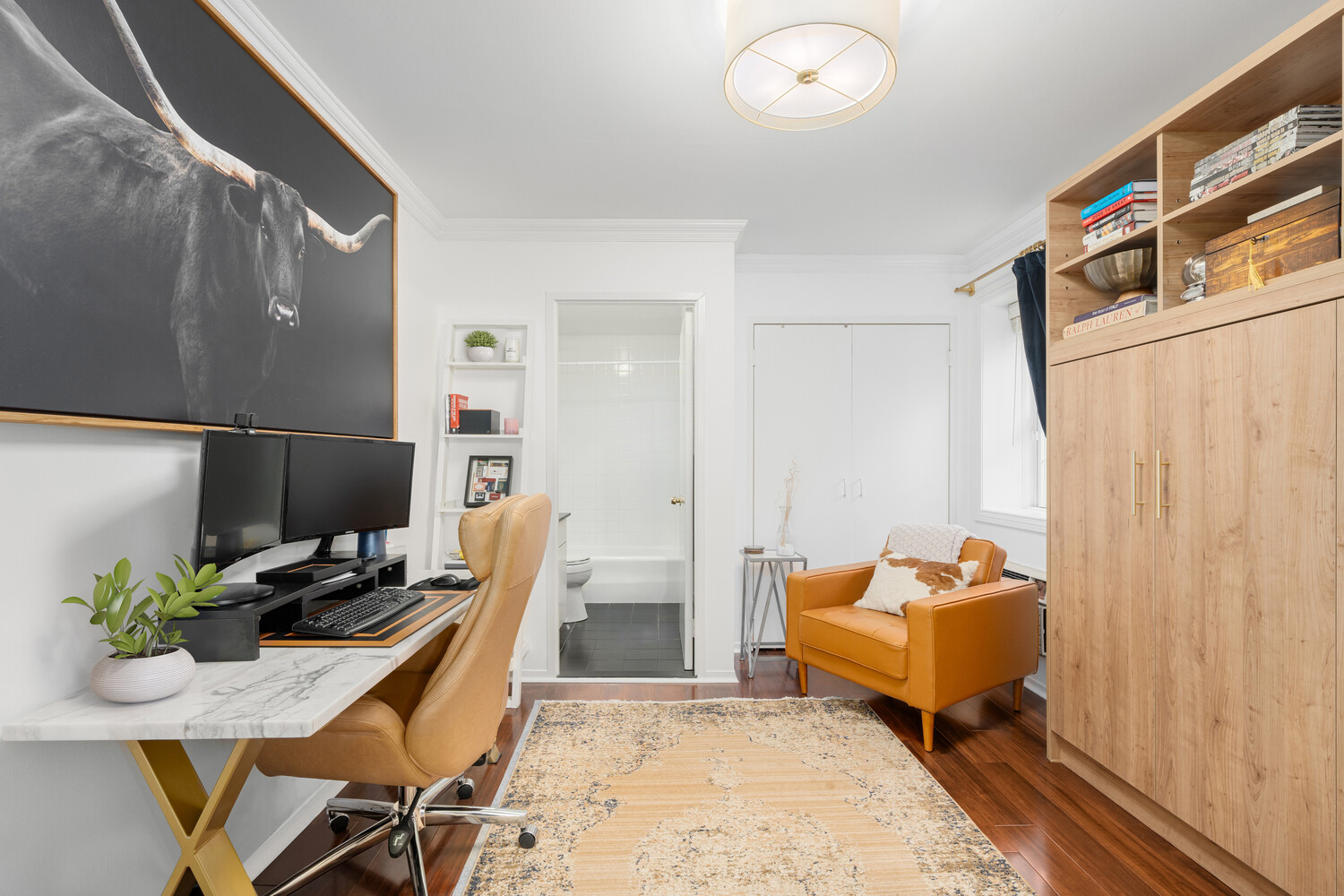 40 East 74th Street, Unit 1 Manhattan, NY 10021 - Photo 5 of 11 a dining room with furniture and a potted plant