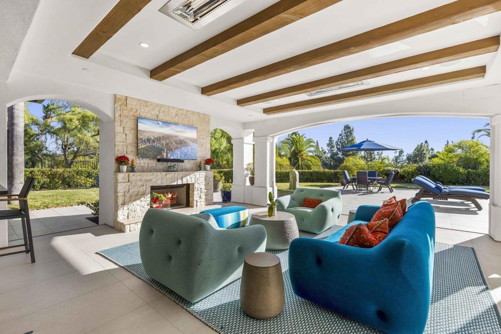 3226 Violet Ridge Encinitas, CA 92024 - Photo 21 of 54 a living room with fireplace furniture and a floor to ceiling window