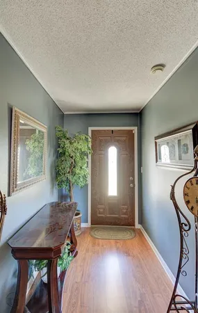 a view of a livingroom with furniture and a window