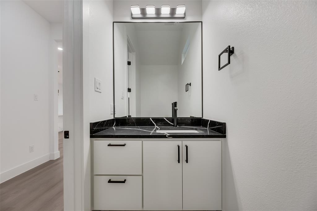 1651 East Overton Road Dallas, TX 75216 - Photo 9 of 21 a sink and mirror