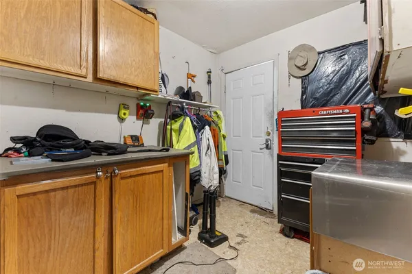a view of storage and utility room with racks on the wall