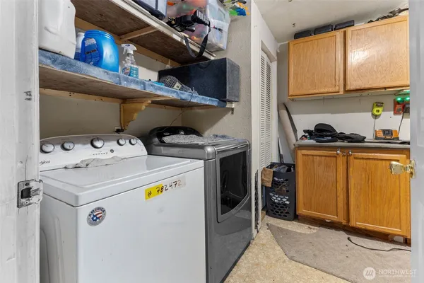 a utility room with dryer and washer