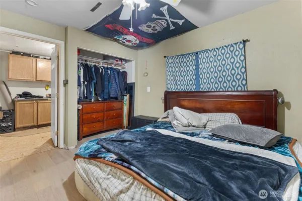 a bedroom with a bed and a chandelier