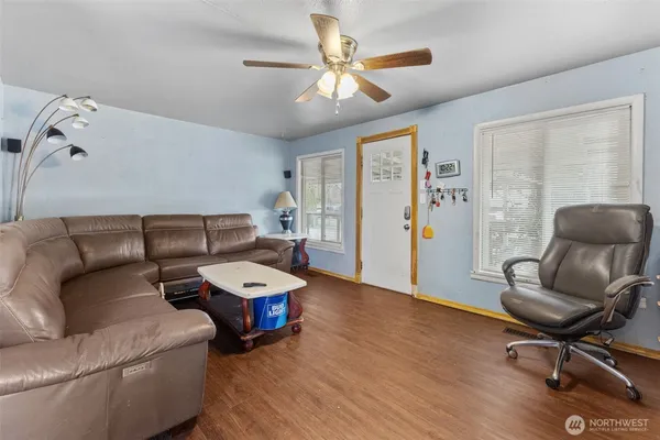 a dining room with furniture and window