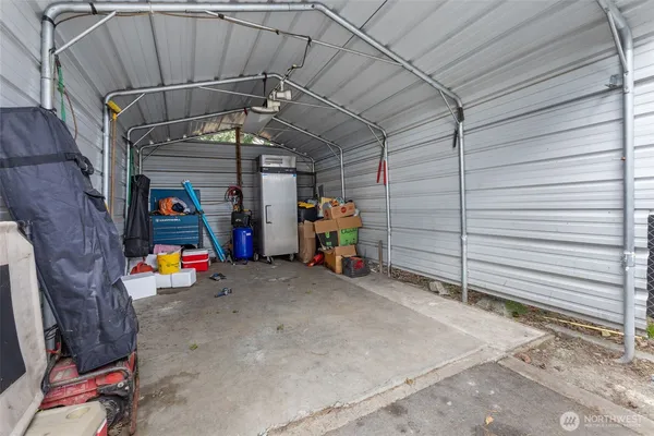 a view of a street with cars parked in front of it