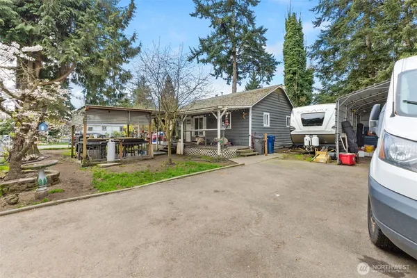 a front view of a house with garden