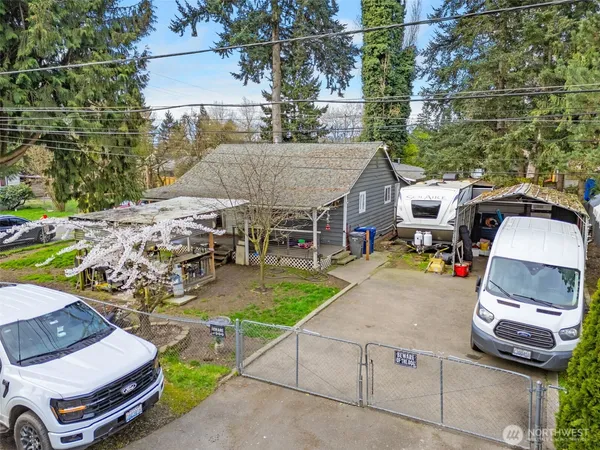 an aerial view of a house with garden space and street view