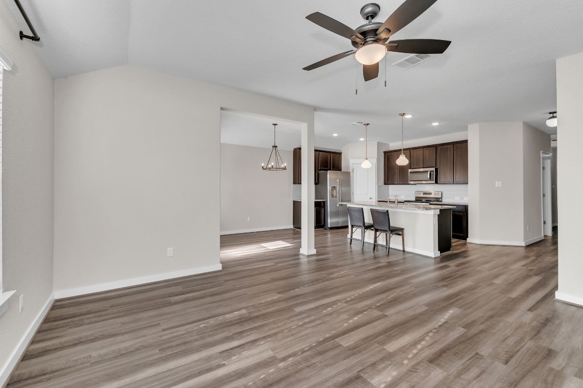 300 Colthorpe Lane Hutto, TX 78634 - Photo 17 of 36 a view of kitchen with cabinets microwave and refrigerator