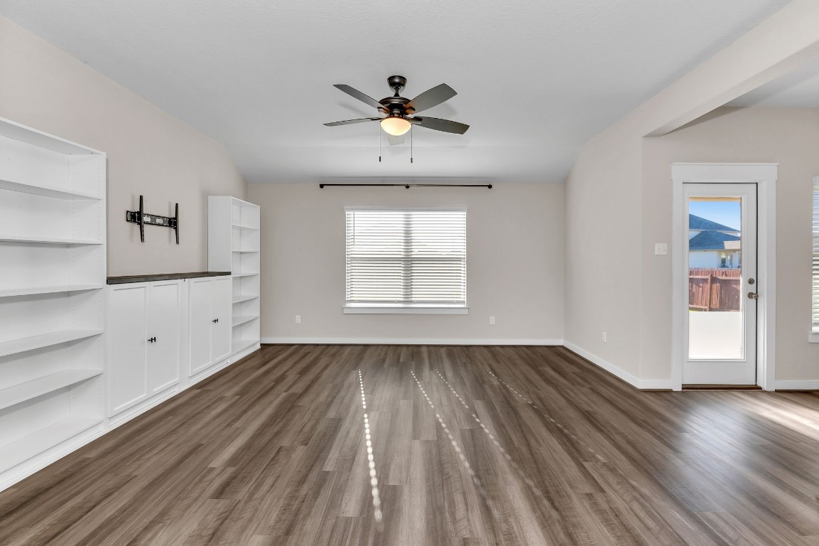 300 Colthorpe Lane Hutto, TX 78634 - Photo 19 of 36 a view of empty room with wooden floor and fan