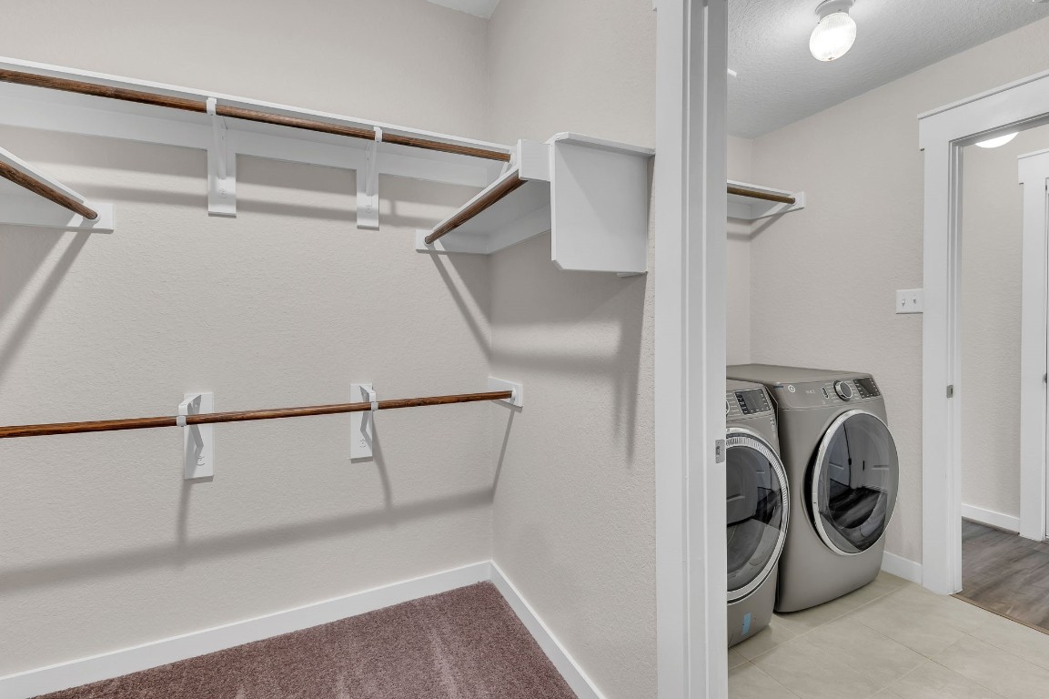 300 Colthorpe Lane Hutto, TX 78634 - Photo 28 of 36 a view of storage and utility room with washer and dryer