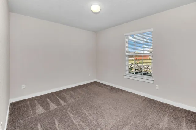 a view of a backyard with a garden