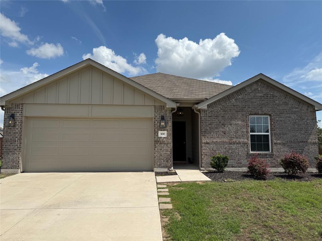 300 Colthorpe Lane Hutto, TX 78634 - Photo 3 of 36 a front view of a house with garden