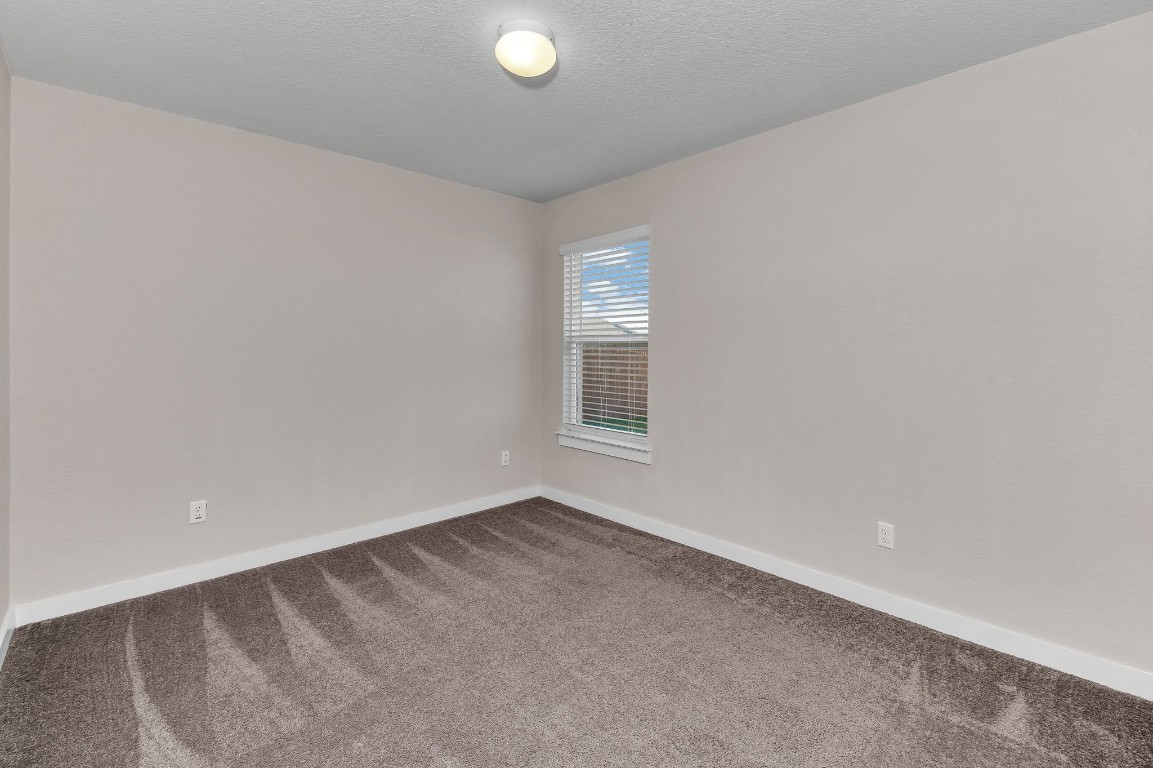 300 Colthorpe Lane Hutto, TX 78634 - Photo 31 of 36 a view of an empty room with a window