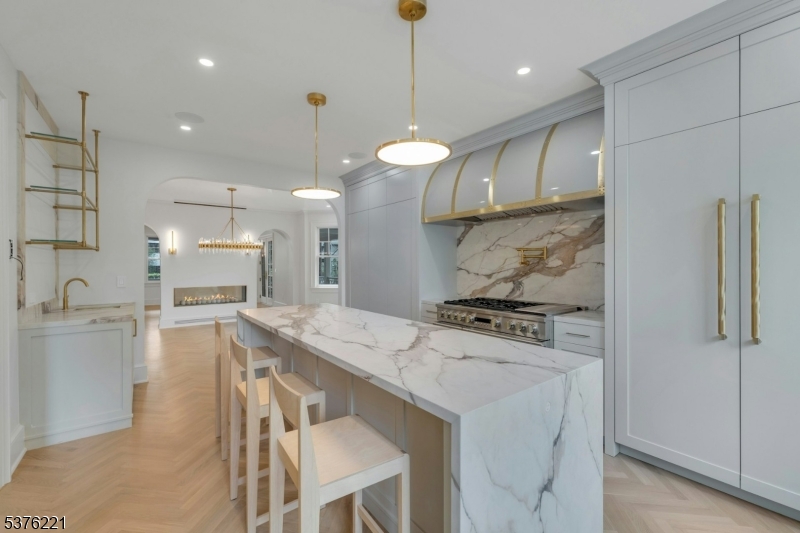 82 Watchung Avenue Montclair, NJ 07043 - Photo 18 of 48 a kitchen with a table chairs stove and refrigerator