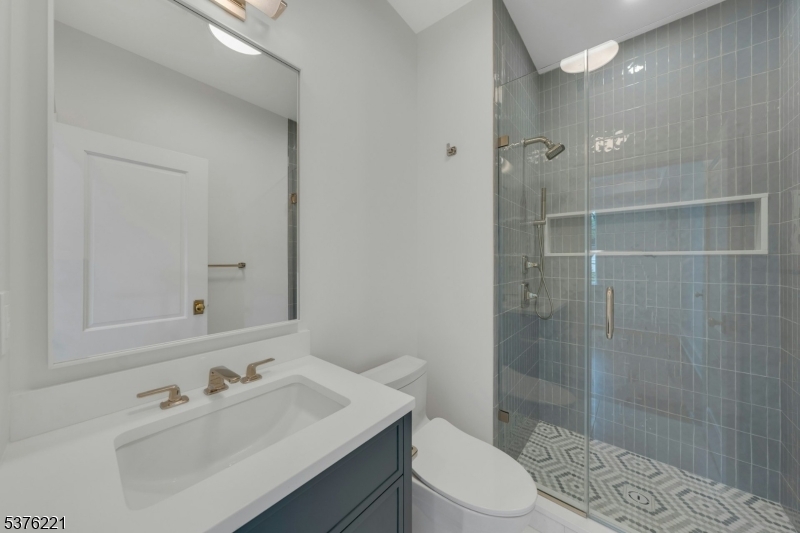 82 Watchung Avenue Montclair, NJ 07043 - Photo 23 of 48 a bathroom with a sink toilet and shower