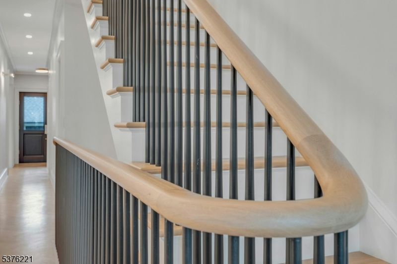 82 Watchung Avenue Montclair, NJ 07043 - Photo 4 of 48 a view of staircase with railing and white walls