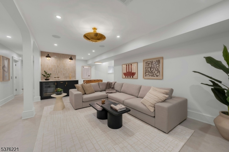 82 Watchung Avenue Montclair, NJ 07043 - Photo 42 of 48 a living room with furniture and a wooden floor
