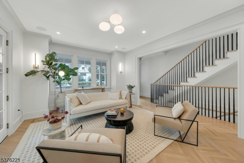82 Watchung Avenue Montclair, NJ 07043 - Photo 9 of 48 a living room with furniture and a chandelier