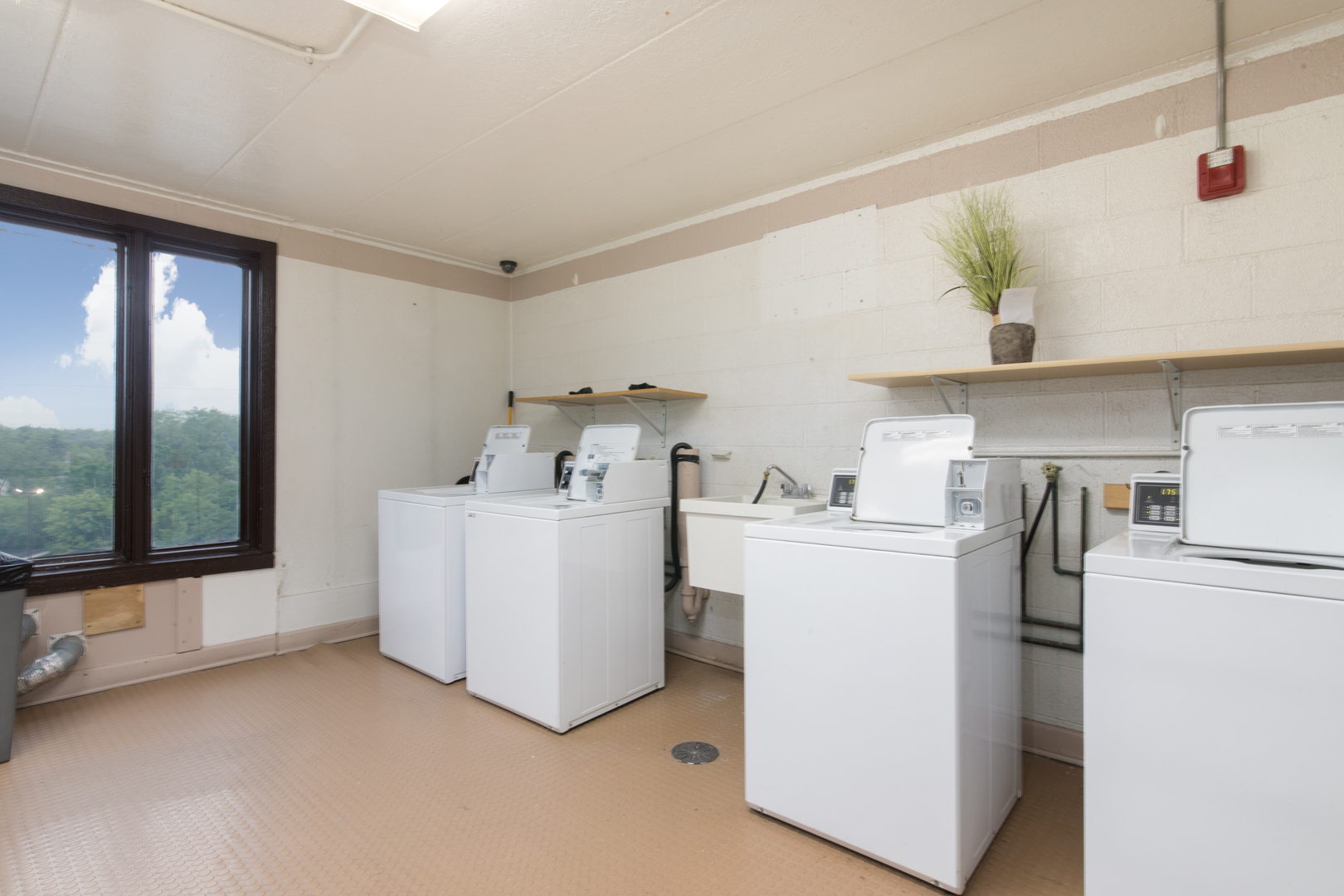 1 Renaissance Place, Unit 309 Palatine, IL 60067 - Photo 25 of 28 a utility room with cabinets washer and dryer