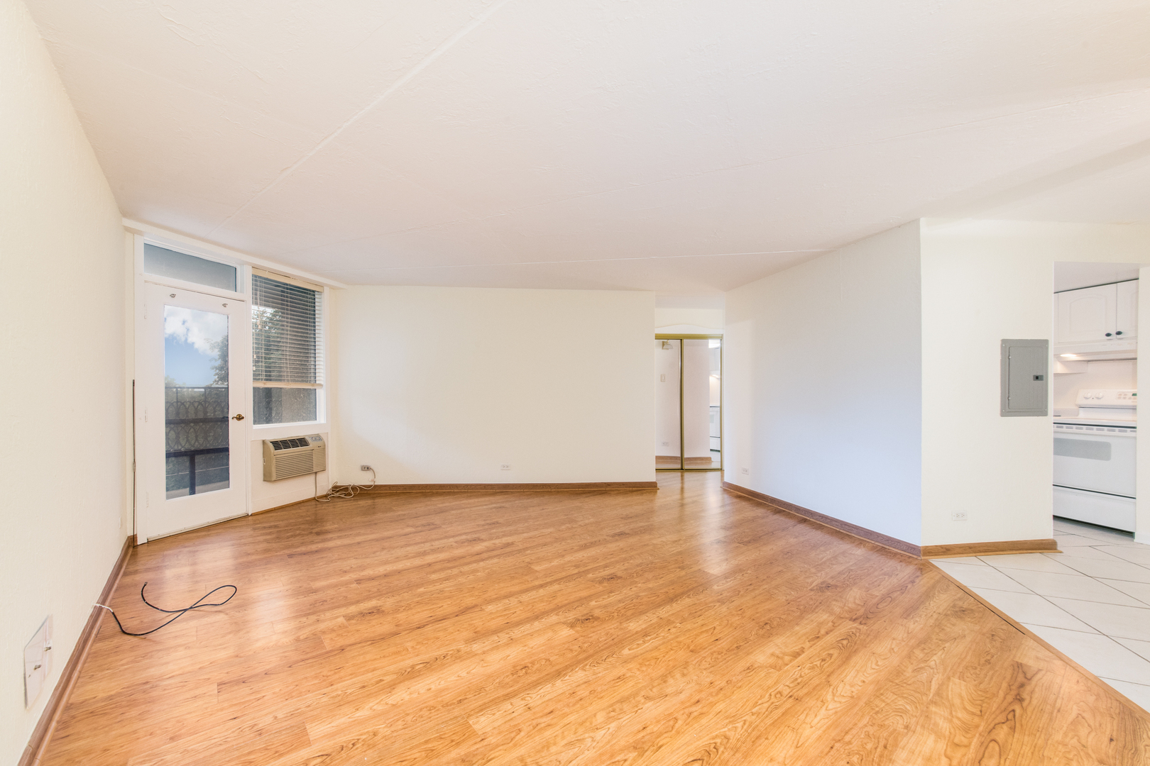 1 Renaissance Place, Unit 309 Palatine, IL 60067 - Photo 7 of 28 a view of an empty room with kitchen and a window
