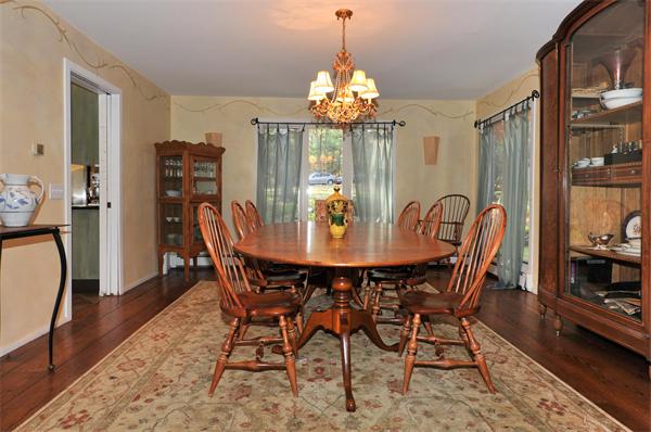 75 Lincoln Road Wayland, MA 01778 - Photo 11 of 27 a view of a dining room with furniture and chandelier