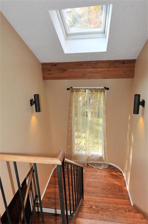 75 Lincoln Road Wayland, MA 01778 - Photo 15 of 27 a view of an empty room with wooden floor and a window