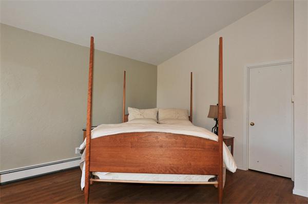 75 Lincoln Road Wayland, MA 01778 - Photo 17 of 27 a bed sitting in a bedroom next to a window