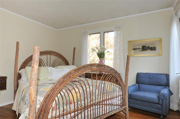 75 Lincoln Road Wayland, MA 01778 - Photo 22 of 27 a bedroom with a bed and a window