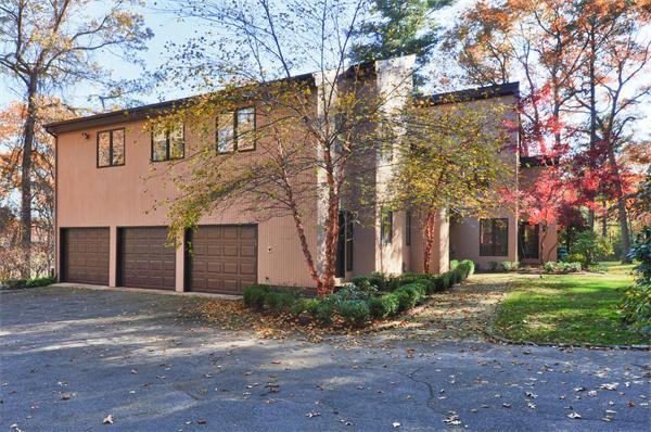 75 Lincoln Road Wayland, MA 01778 - Photo 26 of 27 a front view of a house with garden