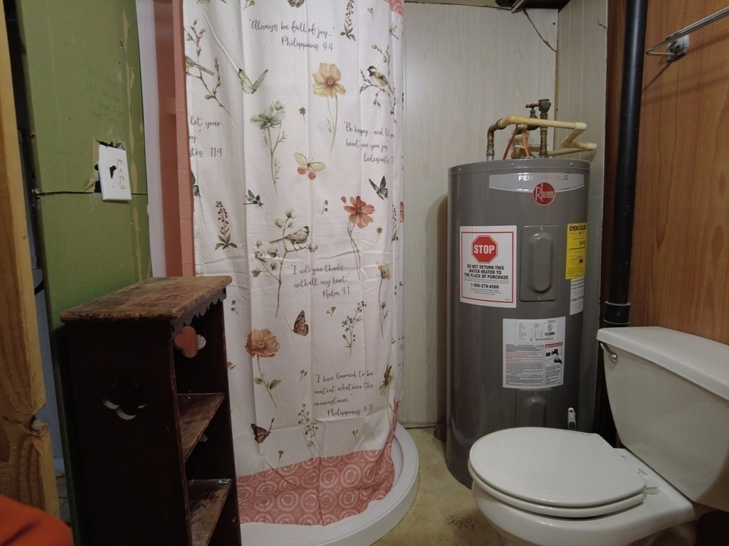 26 Easy Way Springfield, MA 01119 - Photo 12 of 13 a bathroom with a toilet and a shower curtain