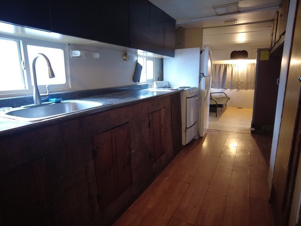 26 Easy Way Springfield, MA 01119 - Photo 8 of 13 a kitchen with stainless steel appliances granite countertop a refrigerator a sink and wooden cabinets