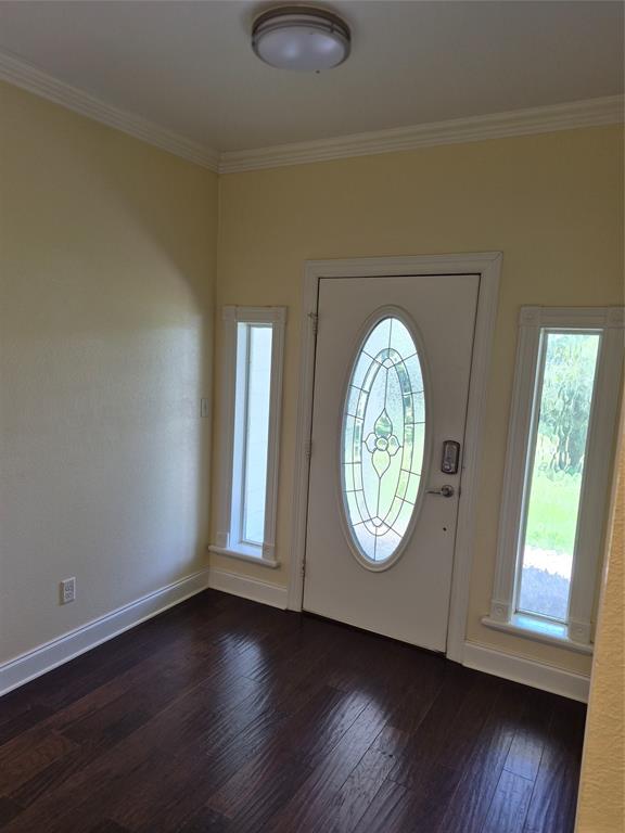 1497 West Loop 571 South Henderson, TX 75654 - Photo 19 of 25 an empty room with wooden floor and windows