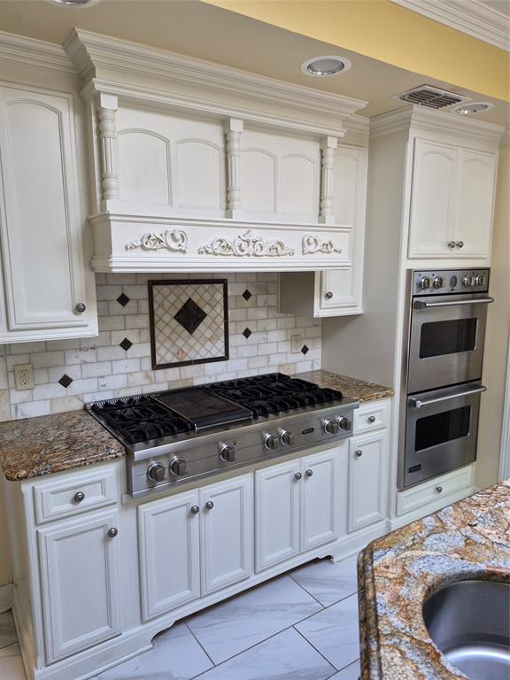 1497 West Loop 571 South Henderson, TX 75654 - Photo 6 of 25 a kitchen with granite countertop a stove sink and cabinets