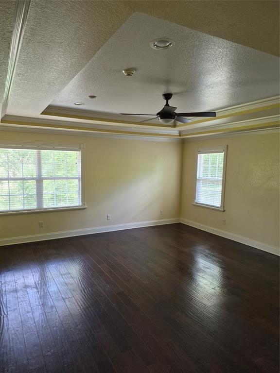 1497 West Loop 571 South Henderson, TX 75654 - Photo 10 of 25 an empty room with wooden floor and windows