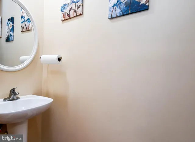 a bathroom with a sink and mirror