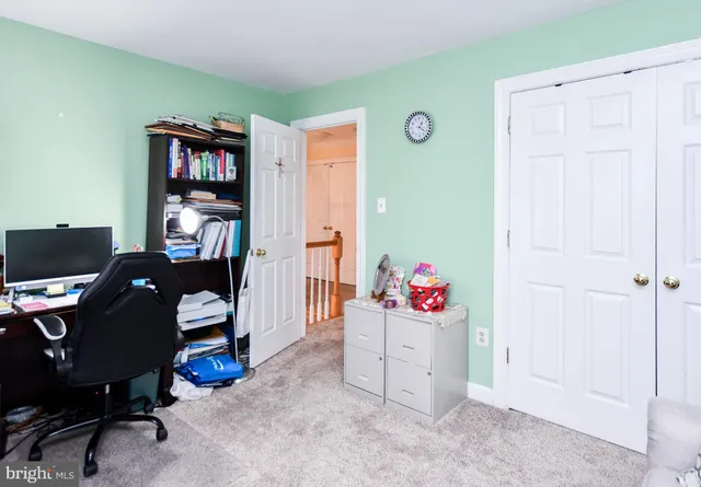 a view of a workspace with furniture