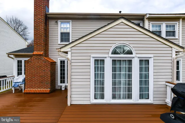 a view of a house with wooden deck