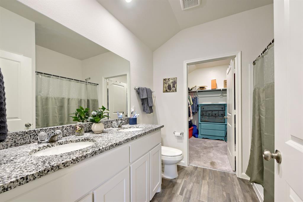 420 Jameson Springtown, TX 76082 - Photo 16 of 29 a bathroom with a granite countertop sink mirror vanity and toilet