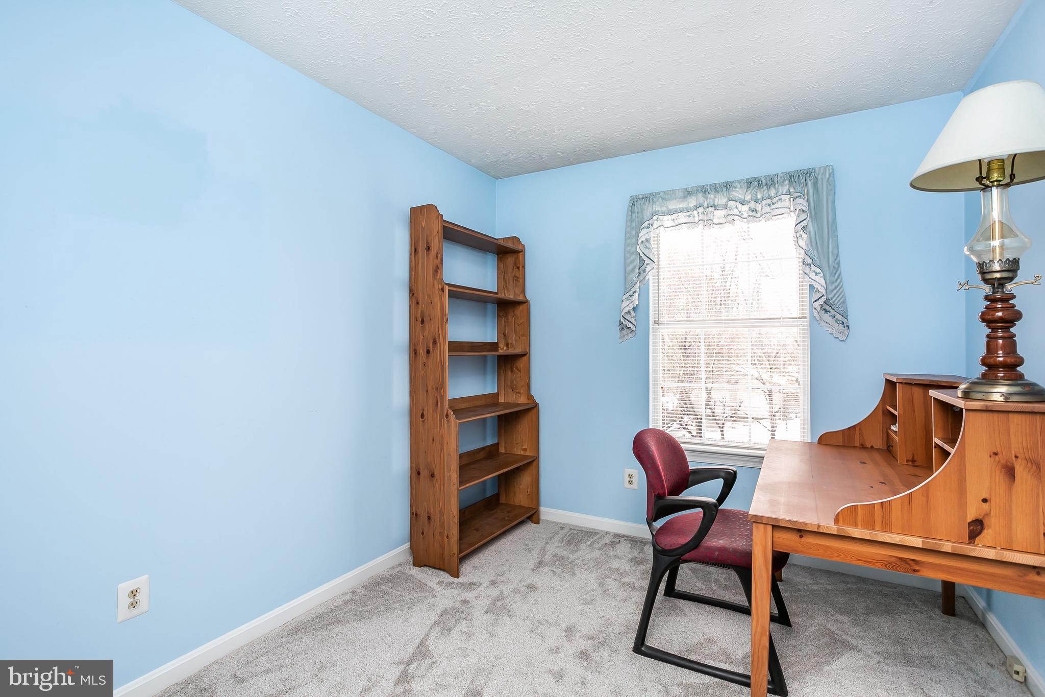 615 Nollmeyer Road Baltimore, MD 21220 - Photo 22 of 46 a living room with furniture and a window