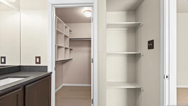 a kitchen with a refrigerator and a sink