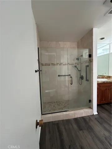 a bathroom with a glass shower door