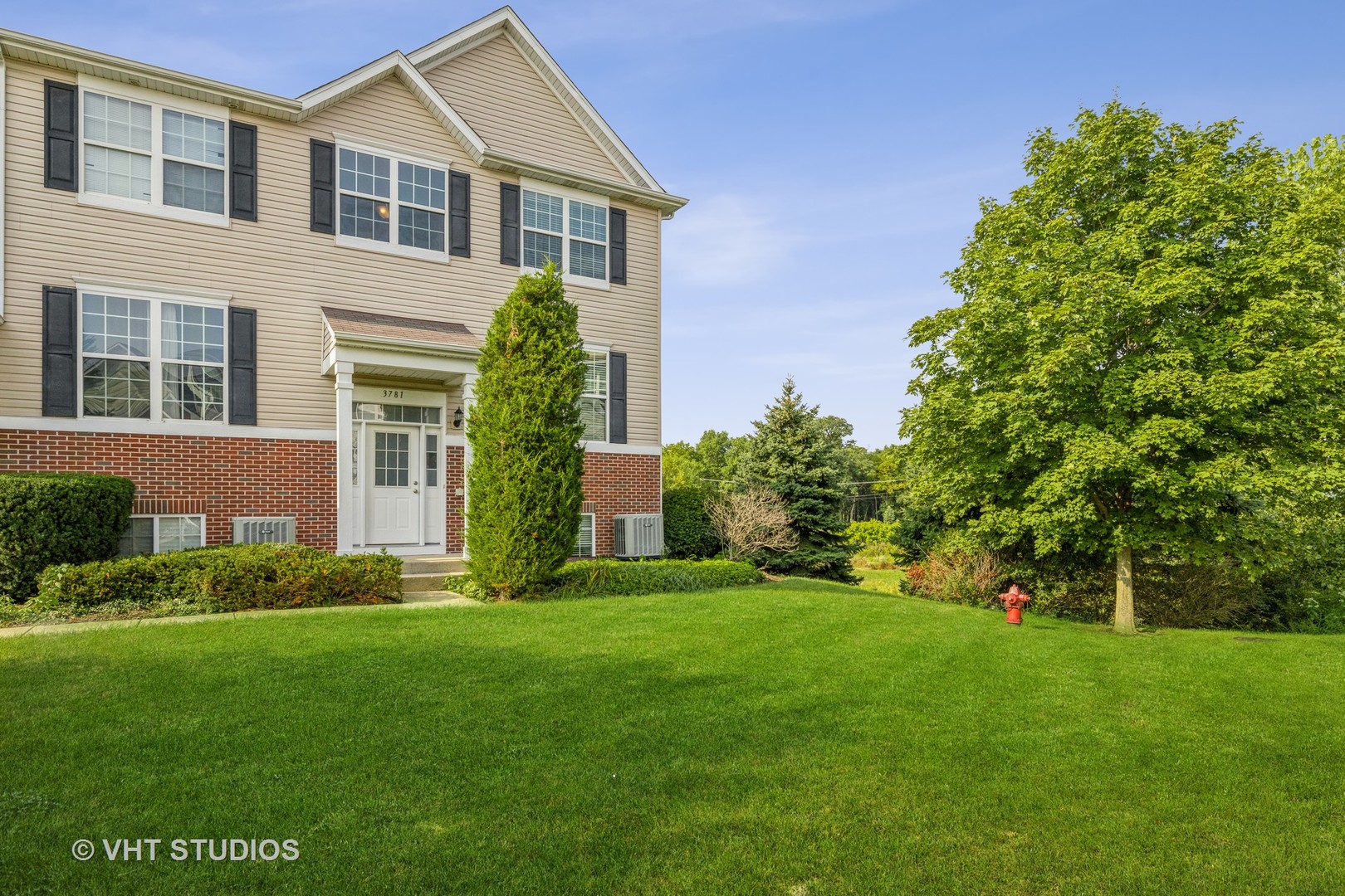 a front view of a house with a yard