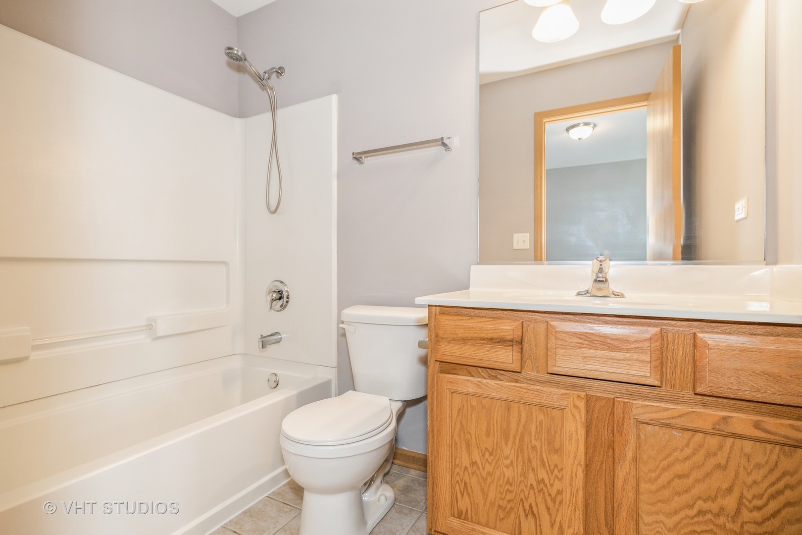 3781 Bailey Road, Unit 404 Yorkville, IL 60560 - Photo 15 of 21 a bathroom with a sink a toilet and shower