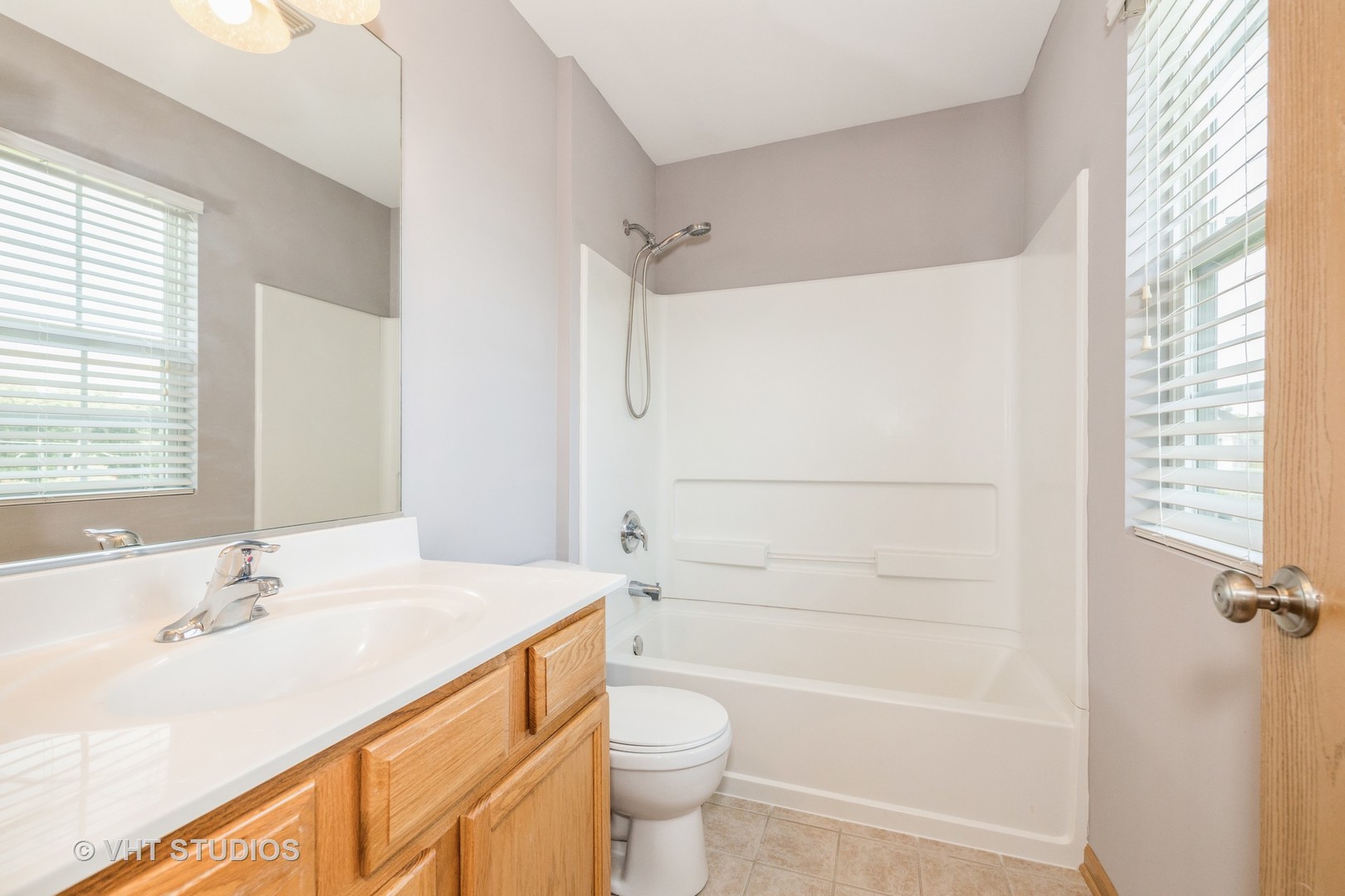 3781 Bailey Road, Unit 404 Yorkville, IL 60560 - Photo 10 of 21 a bathroom with a sink a toilet and shower