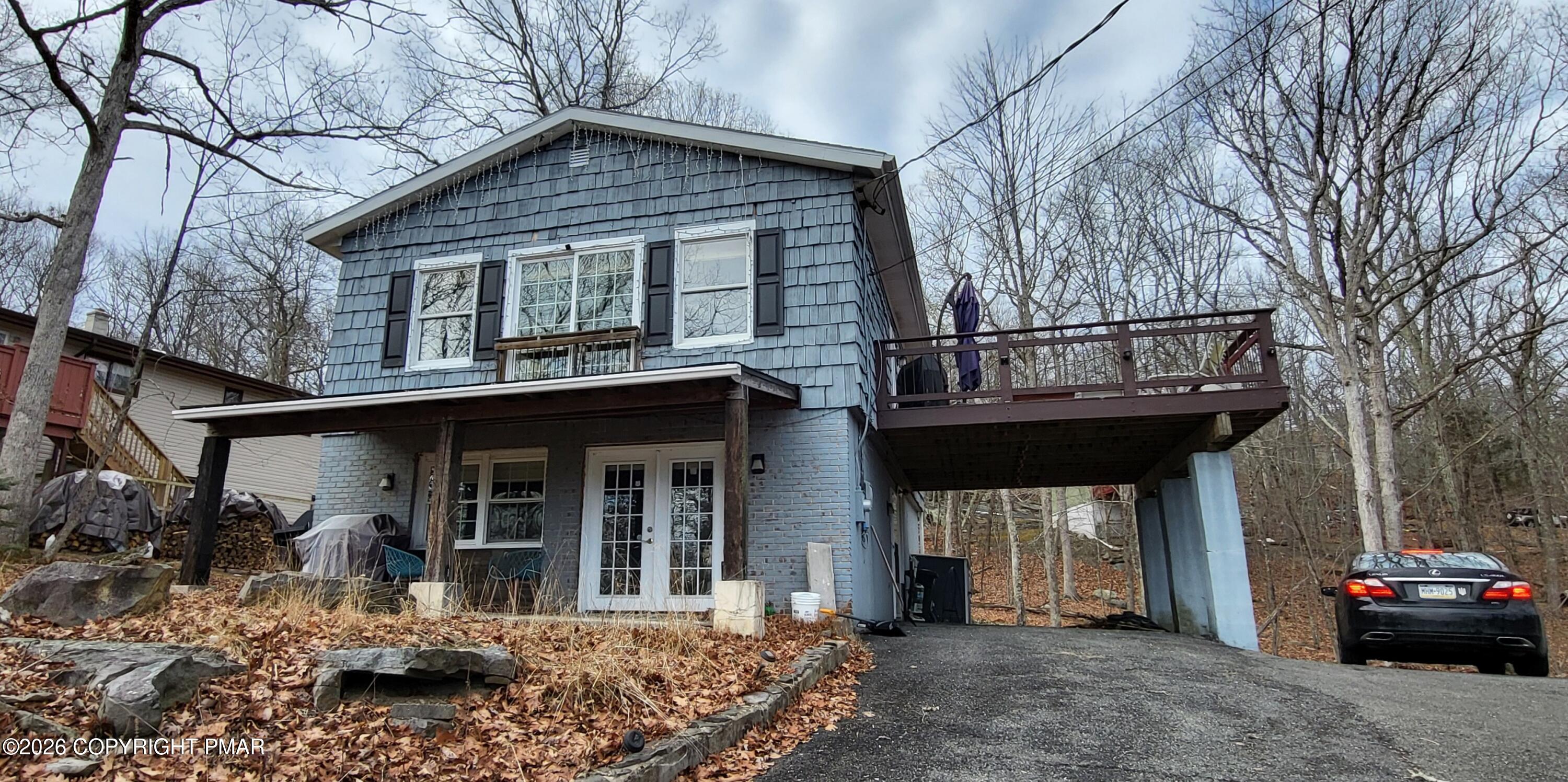 a front view of a house with garage