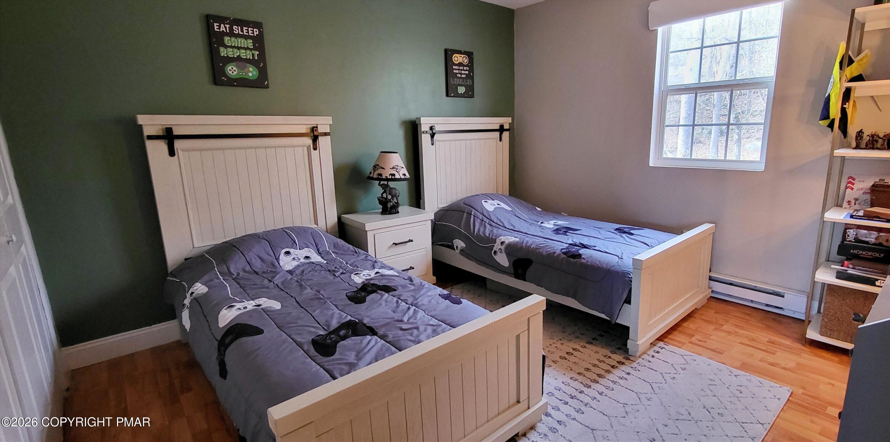 1093 Porter Drive Bushkill, PA 18324 - Photo 14 of 66 a bed room with a bed and a window