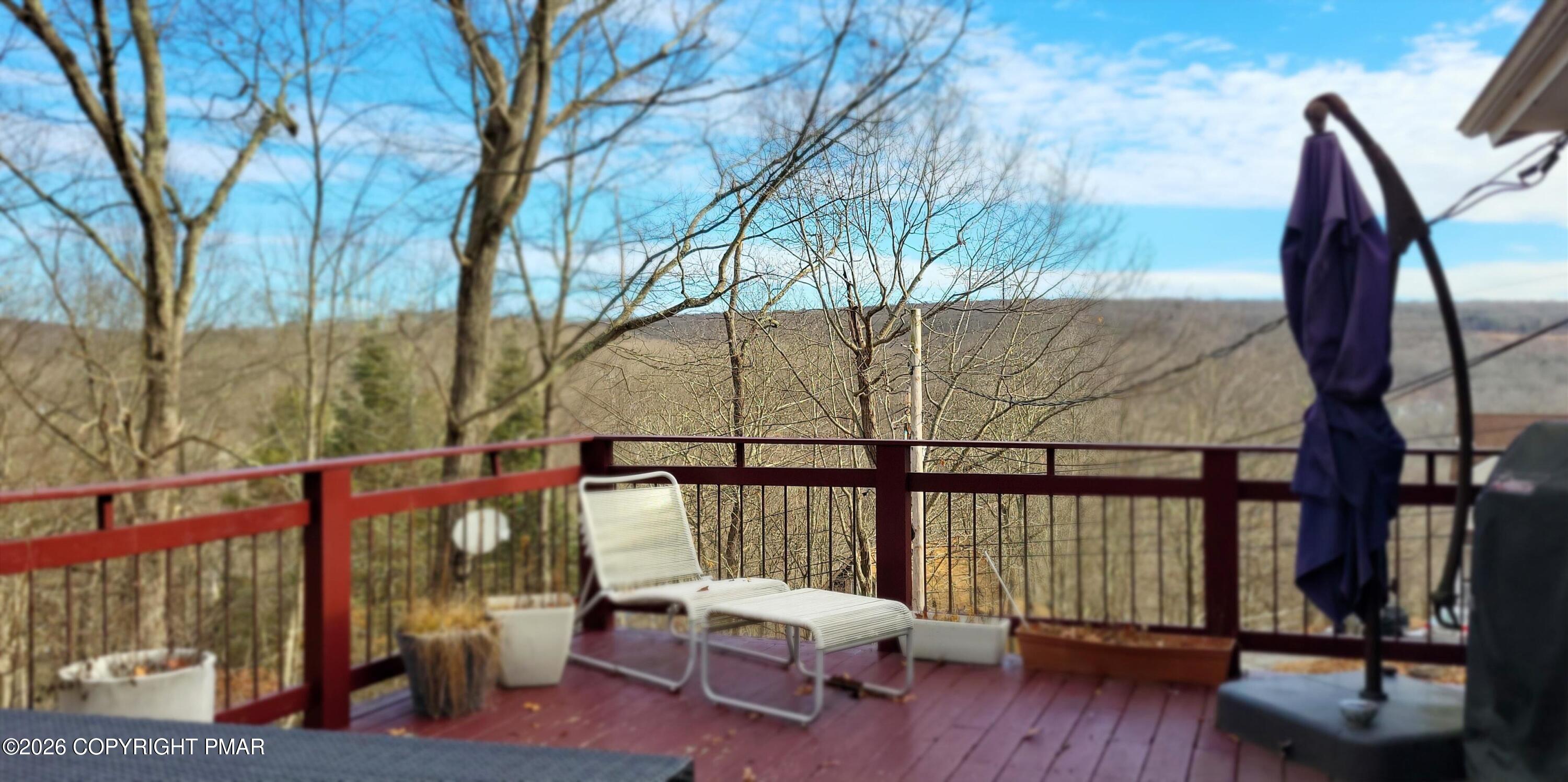 1093 Porter Drive Bushkill, PA 18324 - Photo 20 of 66 a view of a chairs and table in the balcony