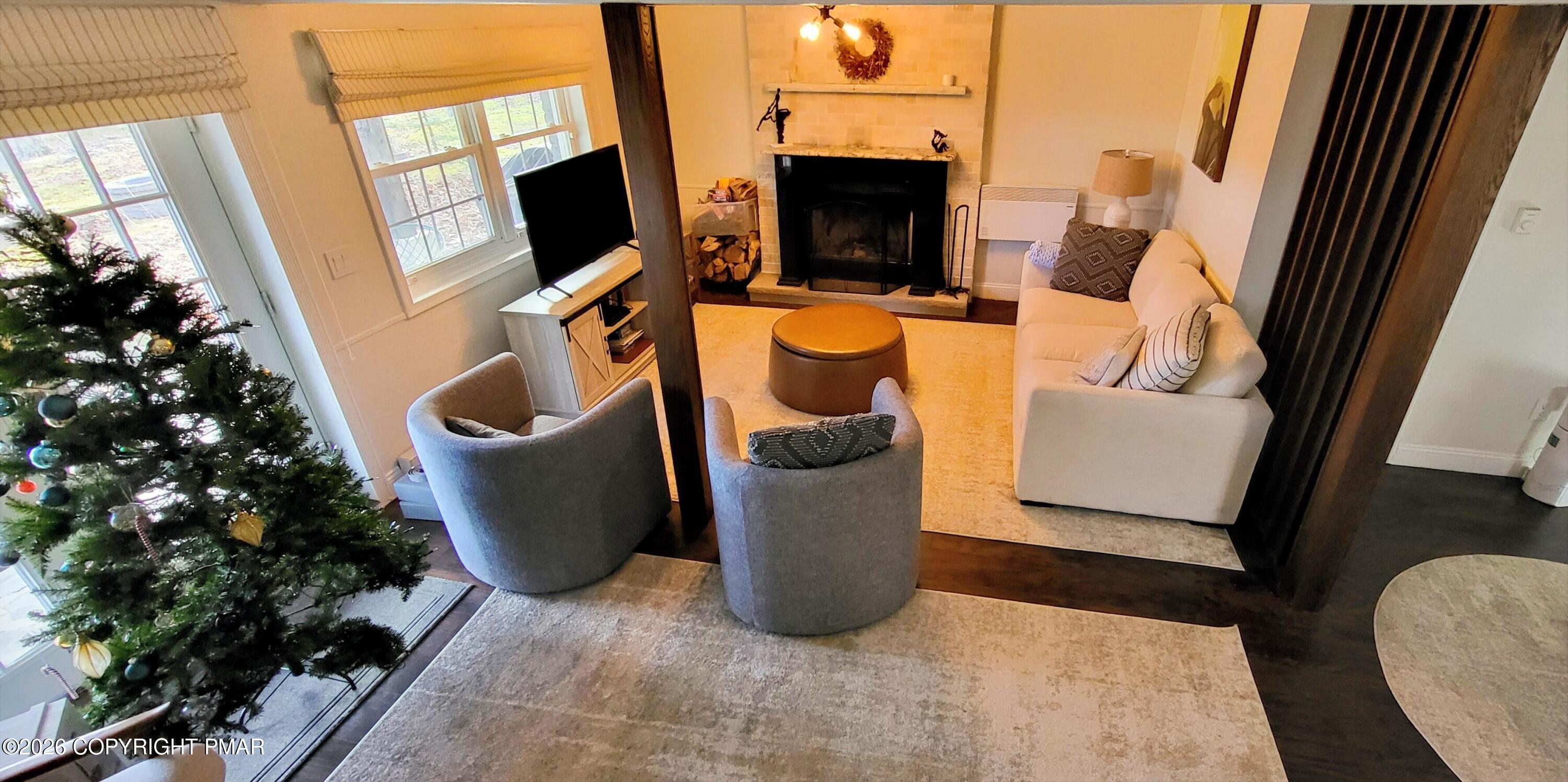 1093 Porter Drive Bushkill, PA 18324 - Photo 21 of 66 a living room with furniture and a flat screen tv