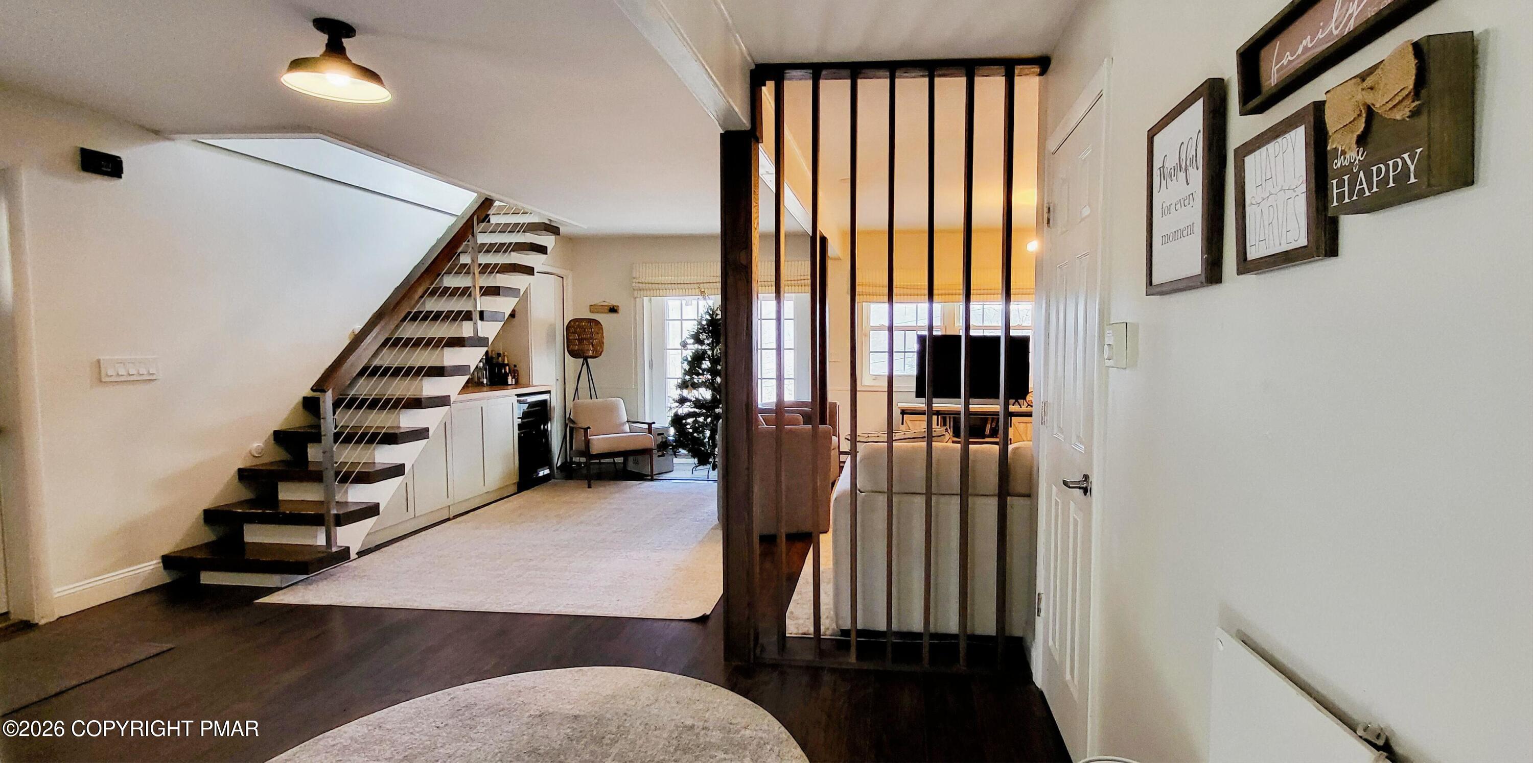 1093 Porter Drive Bushkill, PA 18324 - Photo 25 of 66 a view of a hallway with windows and stairs