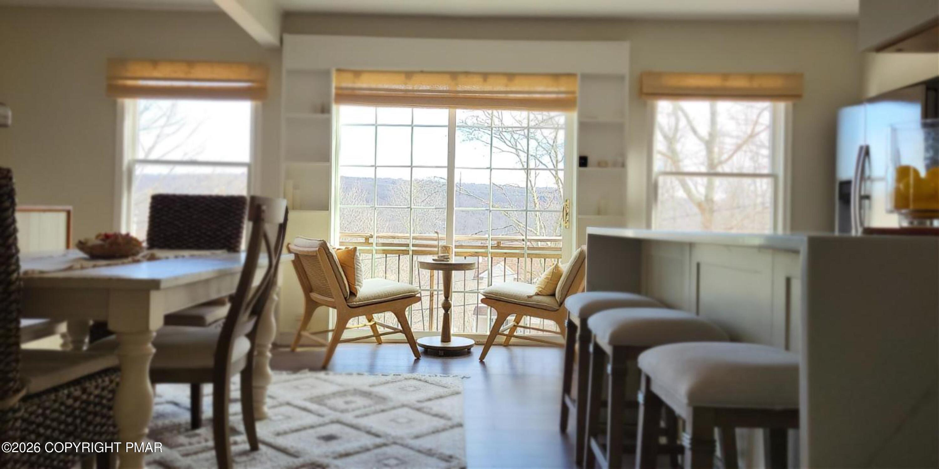 1093 Porter Drive Bushkill, PA 18324 - Photo 3 of 66 a view of a dining room with furniture and wooden floor